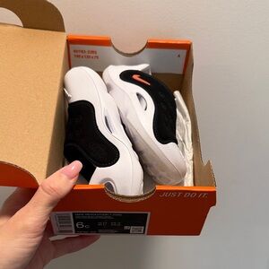 Nike White and Black Kids Sneakers with Coral Accent